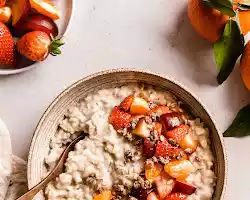 Oatmeal with chopped fruit and a drizzle of honey or maple syrup